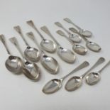 A set of six Edward VII silver Old English pattern dessert spoons, Sheffield 1902, and seven tea