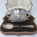 A George V silver porringer and matching spoon, London 1925, 8.2 ozt, in a fitted brown leather case