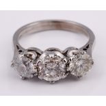 An 18ct white gold three stone diamond ring, ring size K Diamond weight 1.9ct approx