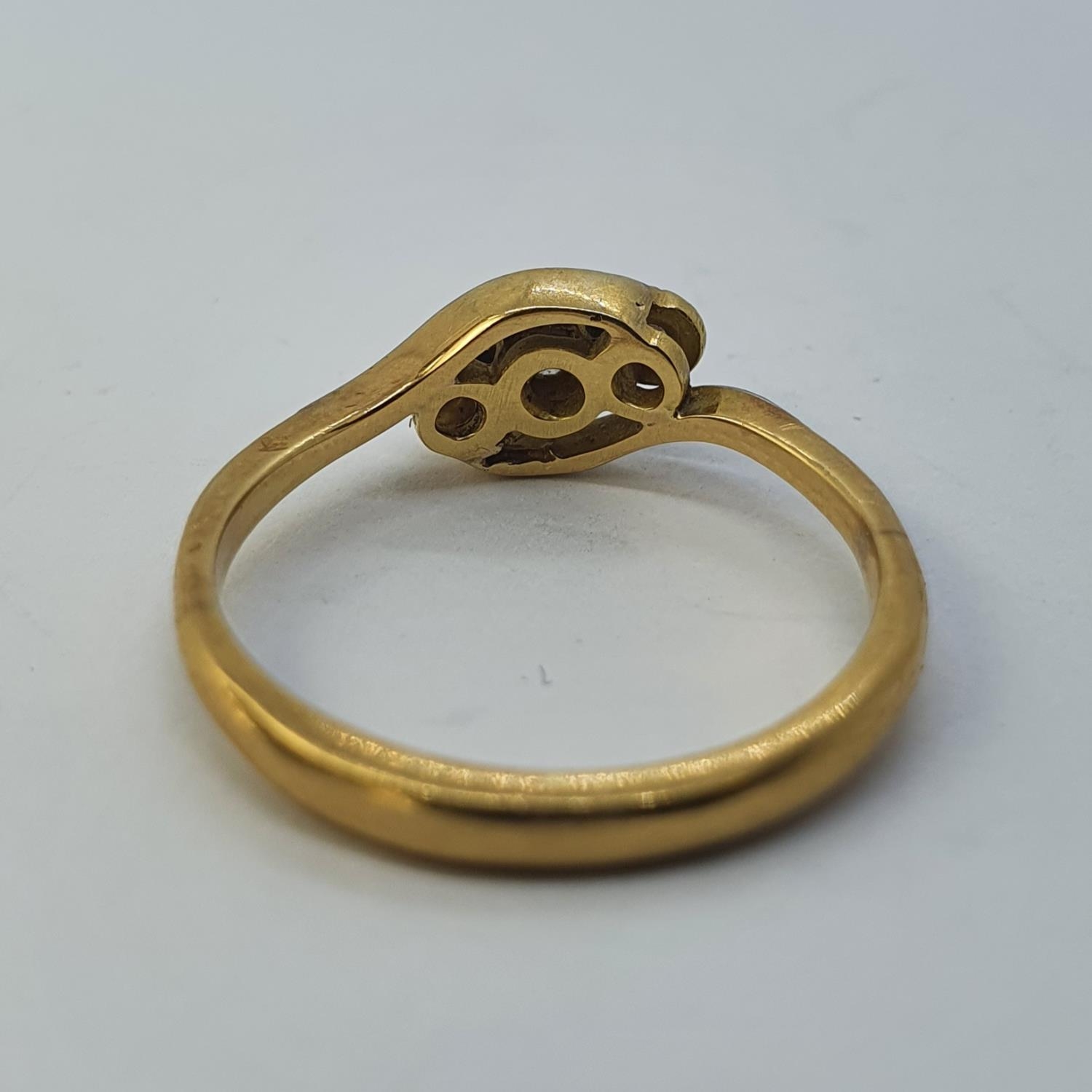 An 18ct gold and three stone diamond ring, ring size N All in 2.9g - Image 3 of 3