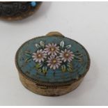 A late 19th/early 20th century brass snuff box, with a micro mosiac top decorated flowers, 4 cm