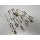 A pair of Victorian sugar tongs, two pairs of sugar tongs and various flatware, various dates and