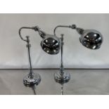 A pair of chrome and glass adjustable table lamps, by Andrew Martin, 49 cm high (2) The wire has