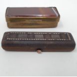 A late 18th/early 19th century carved horn needle box, the top inset with yellow coloured metal,