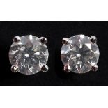 A pair of 18ct white gold diamond stud earrings Each diamond approx. 0.5ct