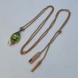 A peridot and seed pearl pendant necklace