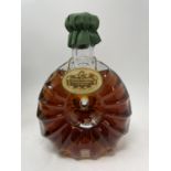 A 70 cl bottle of Remy Martin Cognac, in a Baccarat decanter bottled 27 October 1986, with