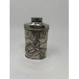 A Chinese silver powder flask, decorated dragons and character marks, 12 cm high Light ware due to