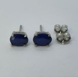 A pair of sapphire stud earrings Treated sapphires