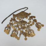 An Eastern gilt metal necklace, in the form of three graduated fish with coin drops, the largest