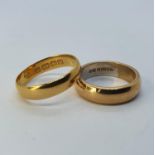 A 22ct gold wedding band, ring size M, 3.9 g and a 9ct gold wedding band, ring size J, 5.2 g (2)