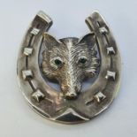 A silver fox head and horseshoe hunting brooch This is a modern copy