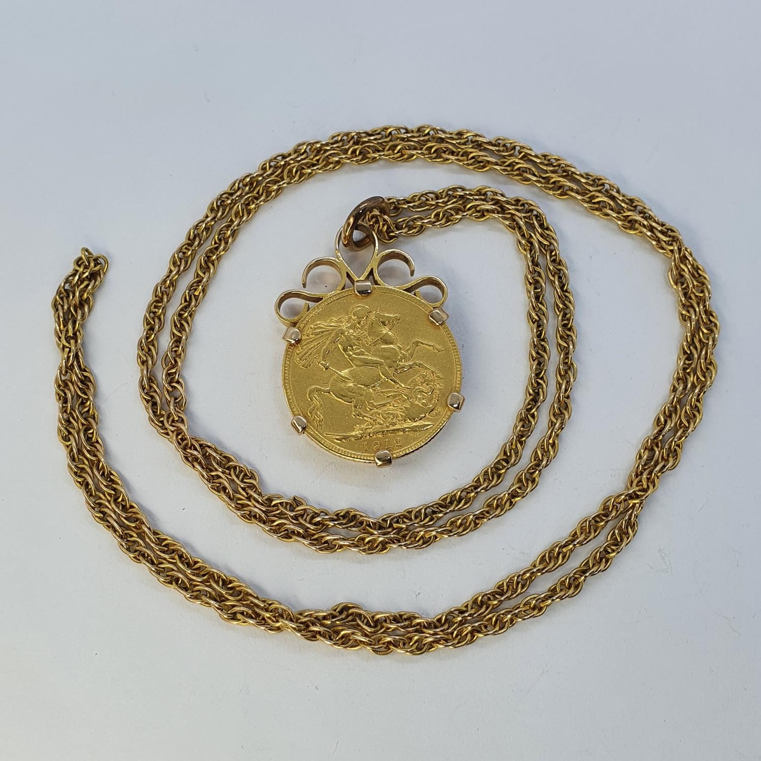 A George V sovereign, 1912, mounted as a pendant, on a chain - Image 2 of 3