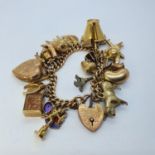 A 9ct gold charm bracelet, with assorted charms, 66.5 g (all in)