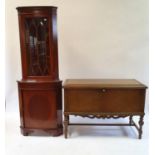 A walnut trunk on stand, 114 cm wide, a mahogany corner cabinet, and a mahogany two tier table (3)
