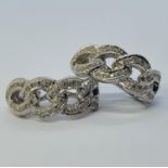 A pair of 18ct white gold and diamond cluster earrings