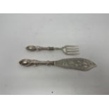 A pair of Victorian fish servers, knife with pierced blade, London 1852 Handles filled