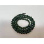 A jade bead necklace