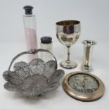 A Victorian silver goblet, London 1872, 3.9 ozt, and two silver topped bottles (3)