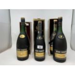 Two litre bottles of Remy Martin cognac, and another, all with boxes (3)