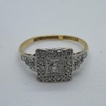 An 18ct white gold and diamond cluster ring, ring size H
