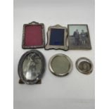 An Edward VII silver photograph frame, Birmingham 1900, and five other silver photograph frames,