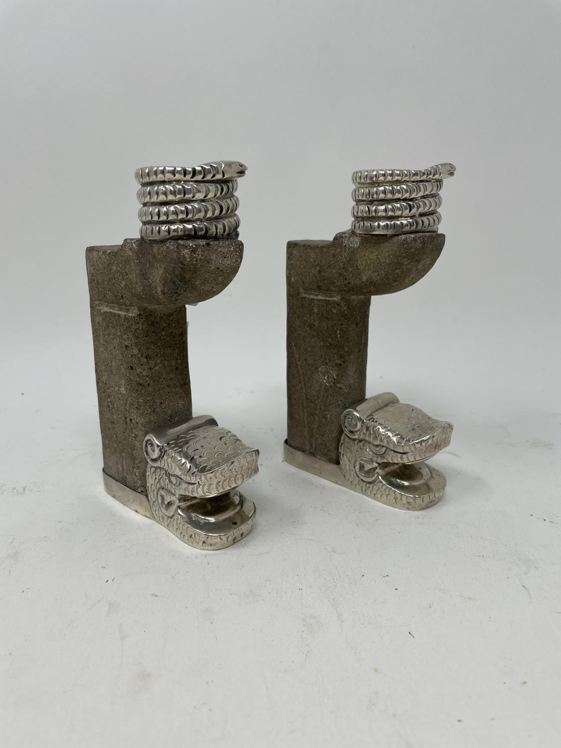 A pair of Mexican silver and carved stone candlesticks, in the form of dragons, 15 cm high (2)