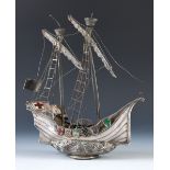 An Arts and Crafts silver coloured metal, enamel and gem set model of a galleon, 34 cm high Unmarked