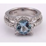 An 18ct white gold, diamond and aquamarine ring, ring size J