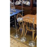 A set of three chrome adjustable standard lamps, 133 cm high (3) The wire has been cut off and