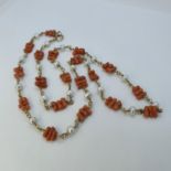 A gold, seed pearl and coral necklace