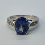 An 18ct white gold, tanzanite and diamond ring, ring size M 1/2