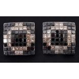 A pair of 14ct white gold, black and white diamond stud earrings