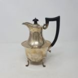 A silver hot water jug, Birmingham 1945, with an ebonised handle, all in weight 14.2 ozt (all in)