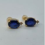 A pair of oval cut sapphire and diamond stud earrings Sapphires 3.00ct approx. Diamonds 0.062ct