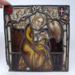A stained glass panel, depicting a saint, 34 x 42 cm Various losses and damage, see images