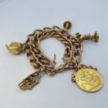 A 9ct gold fob chain with charms, to include a George V sovereign, 1910, 55.5 g