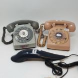 A pink US 500 dial telephone, a telephone, designed by Richard Stark, and a French grey dial