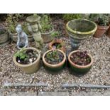 A pair of green glazed garden planters, 37 cm diameter, three other planters and two garden