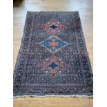 A Persian blue ground rug 200 x 132 cm