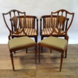 An early 20th century mahogany two seater settee, a matching pair of tub chairs, a pair of chairs,