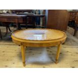 A modern satinwood oval tray top table, on square tapering legs, 98 cm diameter