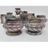 A pair of silver plated lighters, various flatware, a blue and white part dinner service and other