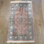 A Persian silk Qum rug, 128 x 76 cm