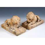 A pair of carved marble lions, on plinth bases, 20 cm wide (2)