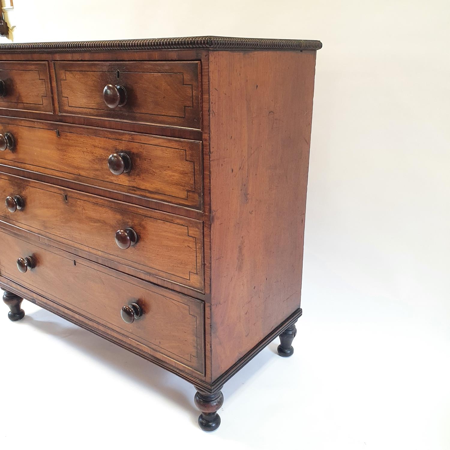 A 19th century mahogany chest, having two short and three long drawers on turned feet, 107 cm wide - Image 5 of 9