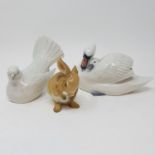 A Royal Copenhagen figure of a dove, boxed, a swan, boxed, and a German porcelain bunny (3) Bunny