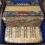 A Barmelo accordion, in a case