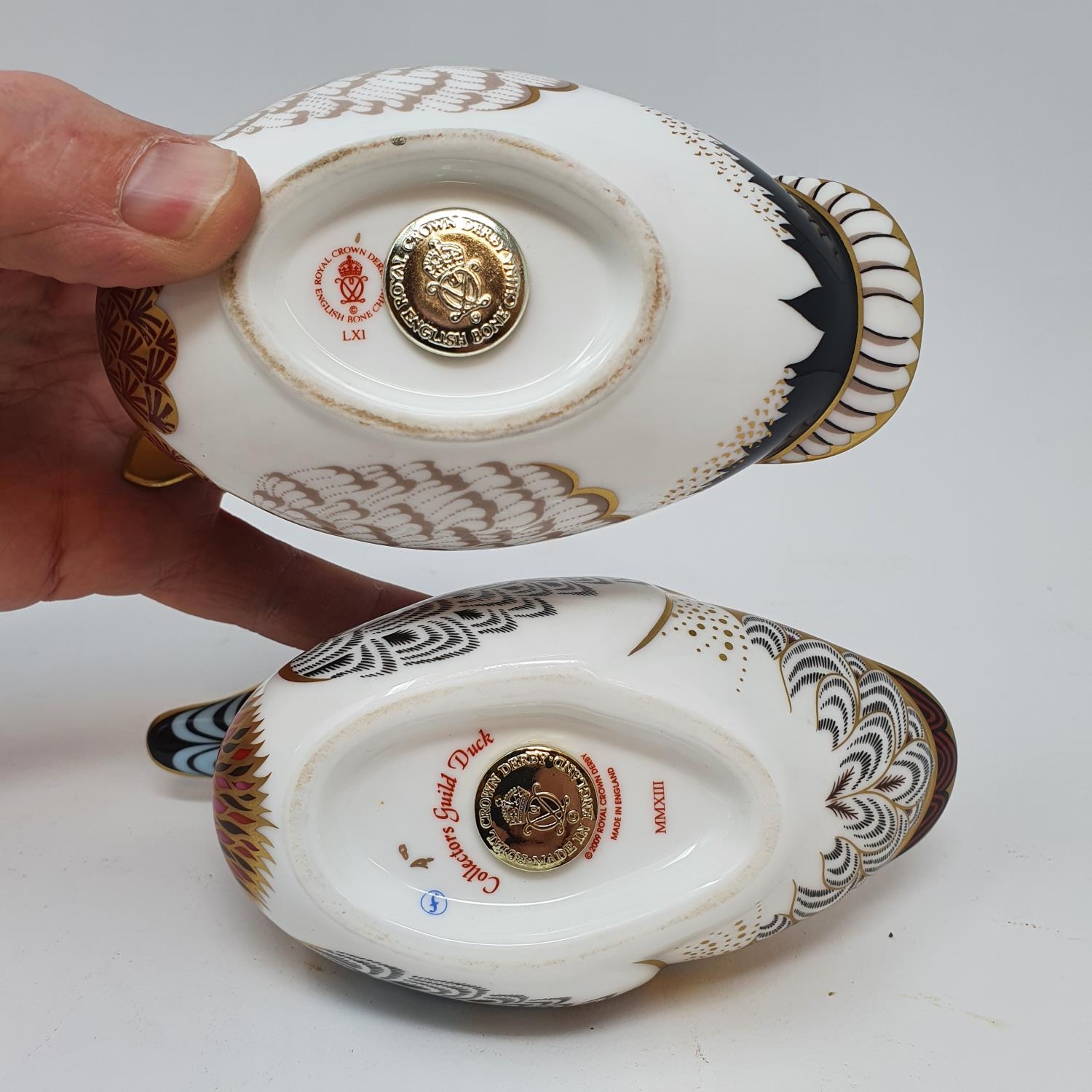 A Royal Crown Derby paperweight, in the from of a duck, its pair, a Royal Doulton Flambe vase and - Image 4 of 9