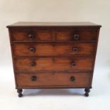 A 19th century mahogany chest, having two short and three long drawers on turned feet, 107 cm wide